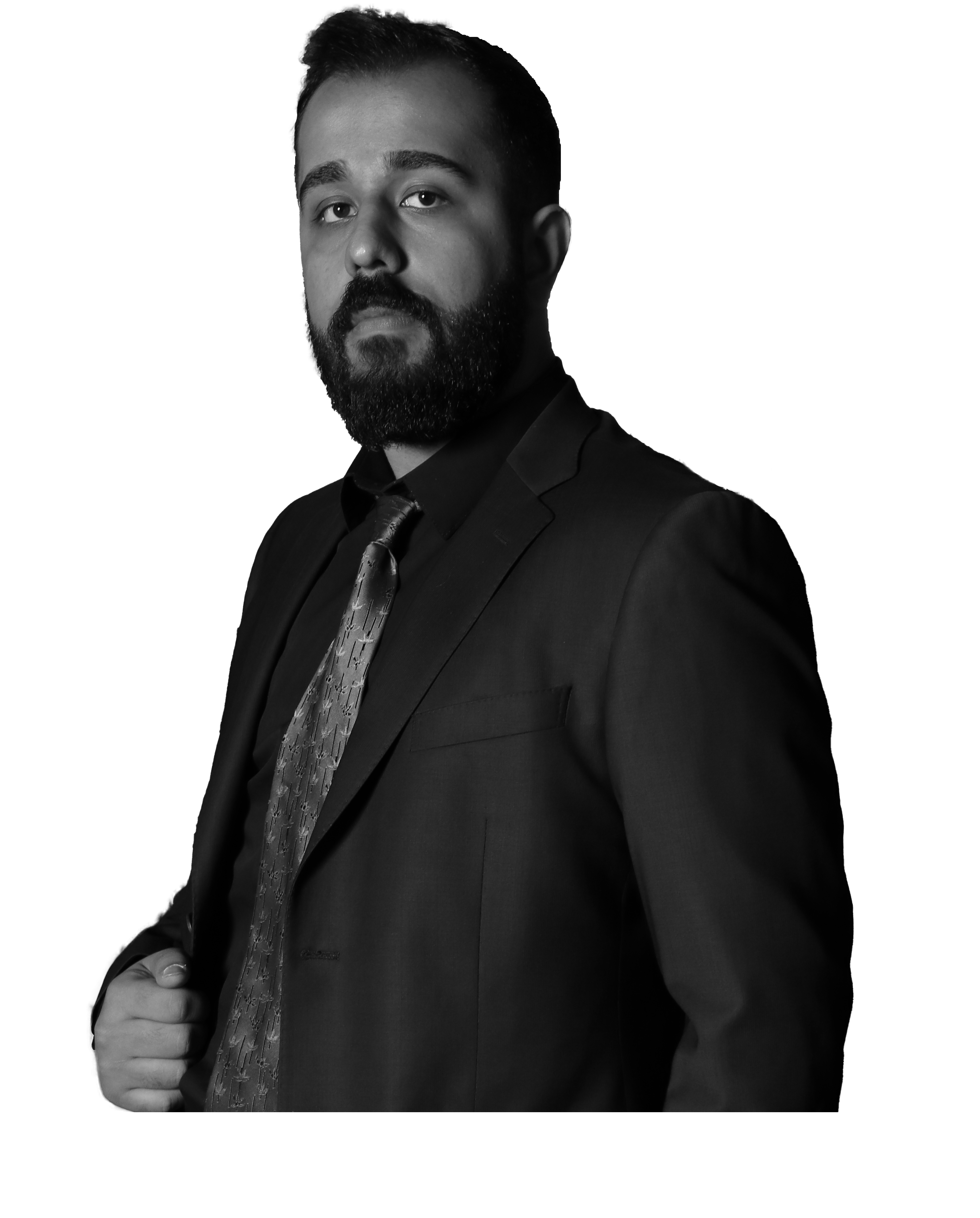 Portrait of Mahyar Zolghadr, a FullStack Developer, in a black suit